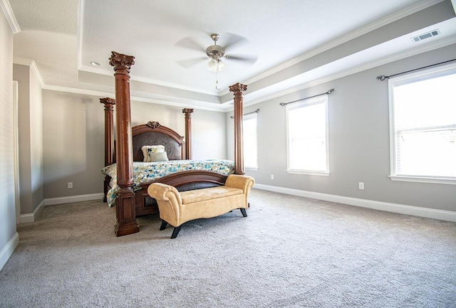 bedroom with carpet, a raised ceiling, ceiling fan, and ornamental molding