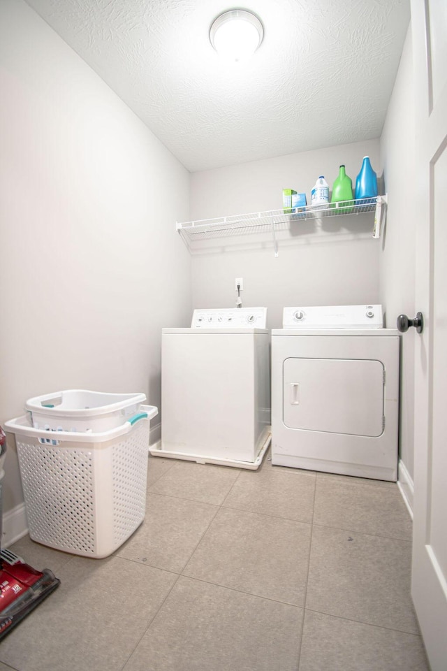 1144 Bubbling Springs Dr, Graniteville, SC 29829 - clothes washing area with baseboards, laundry area, separate washer and dryer, a textured ceiling, and tile patterned floors