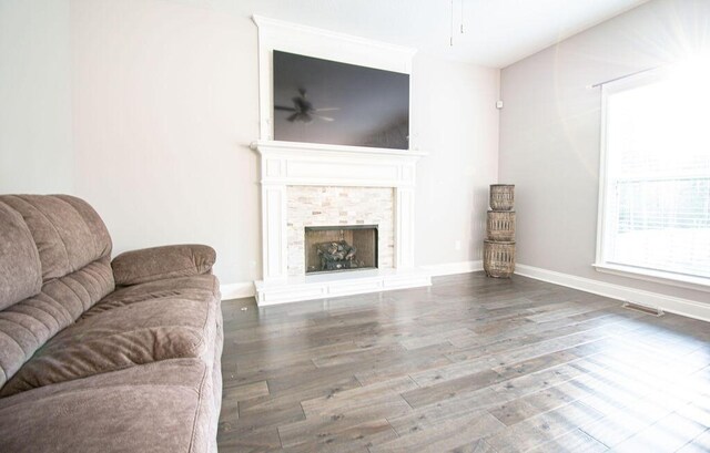 living room featuring hardwood / wood-style flooring and ceiling fan