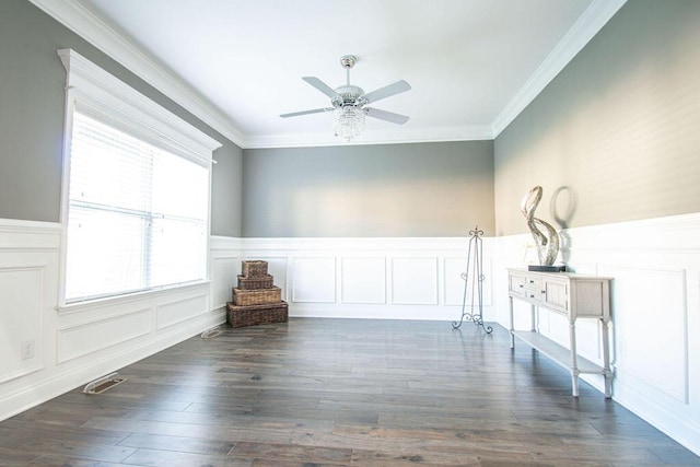 unfurnished room with dark wood-type flooring, ceiling fan, and crown molding