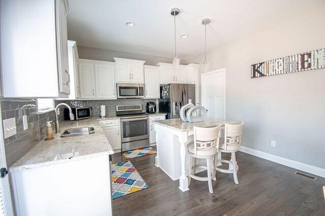 bathroom featuring vanity, hardwood / wood-style flooring, and toilet