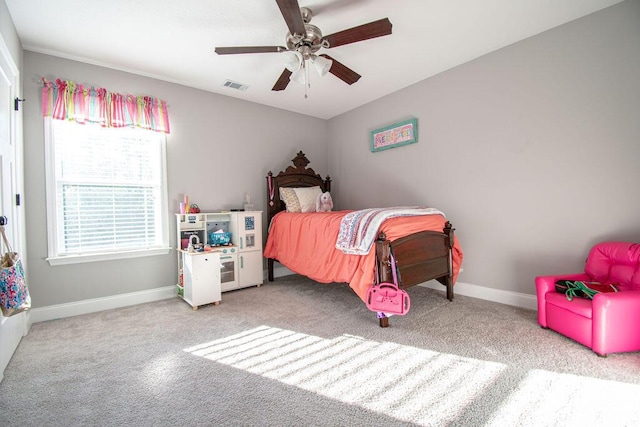 carpeted bedroom with ceiling fan