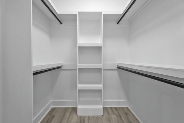 spacious closet featuring light wood-type flooring