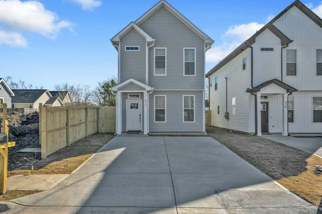 view of front of house featuring fence