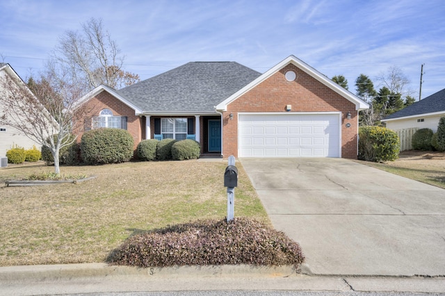 view of front of house featuring a front yard and a garage