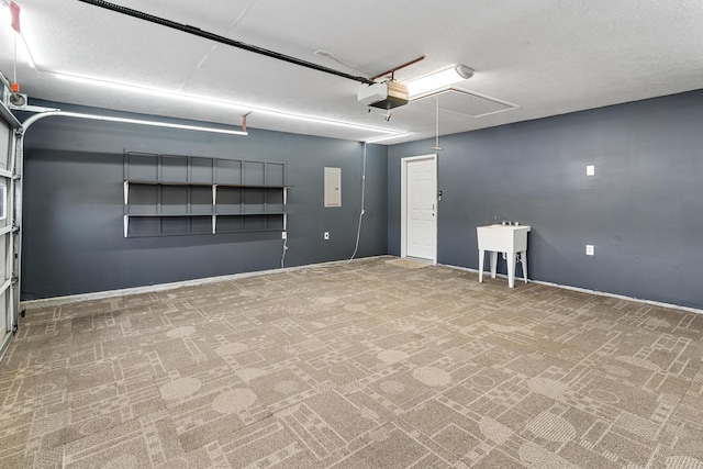 garage featuring electric panel and a garage door opener