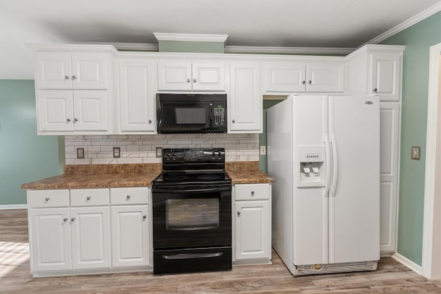 kitchen with black appliances, light wood-type flooring, and backsplash