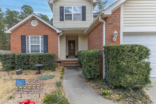 view of front of property with brick siding and an attached garage