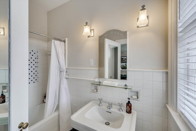 3406 W Richland Ave, Aiken, SC 29801 - bathroom featuring tile walls, shower / tub combo with curtain, and wainscoting