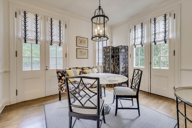 3406 W Richland Ave, Aiken, SC 29801 - dining room featuring healthy amount of natural light, wood finished floors, and a chandelier