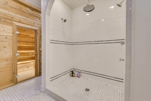 3406 W Richland Ave, Aiken, SC 29801 - bathroom featuring a tile shower, wood walls, and tile patterned floors
