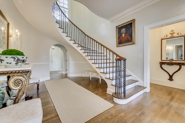 3406 W Richland Ave, Aiken, SC 29801 - stairway featuring arched walkways, crown molding, and wood finished floors