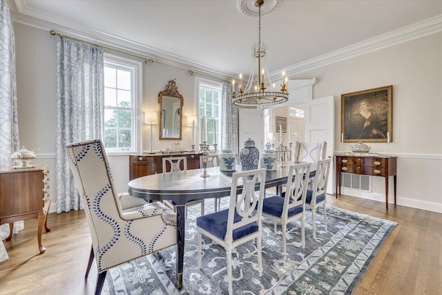 3406 W Richland Ave, Aiken, SC 29801 - dining space featuring a chandelier, crown molding, and light wood-type flooring