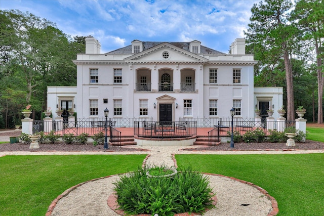 3406 W Richland Ave, Aiken, SC 29801 - neoclassical home with a chimney, stucco siding, and a balcony