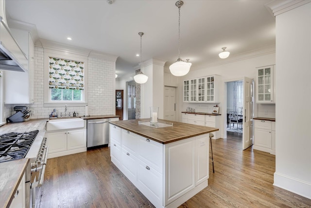 3406 W Richland Ave, Aiken, SC 29801 - kitchen with wood counters, stainless steel appliances, premium range hood, glass insert cabinets, and a breakfast bar