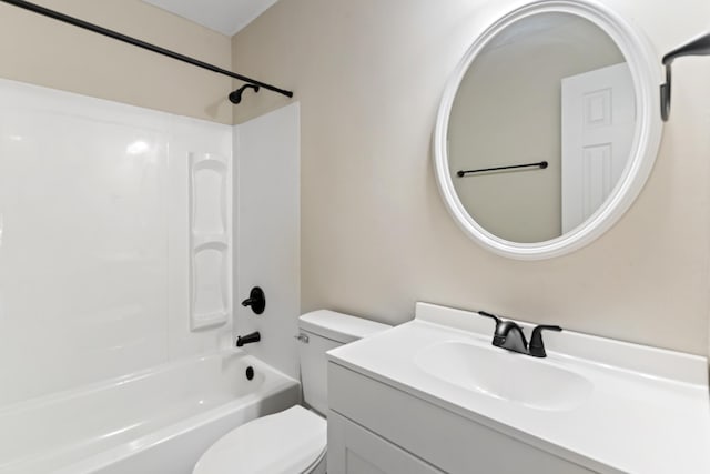 full bath featuring toilet, vanity, and shower / washtub combination