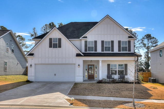 view of front of home featuring covered porch, central AC, and a garage