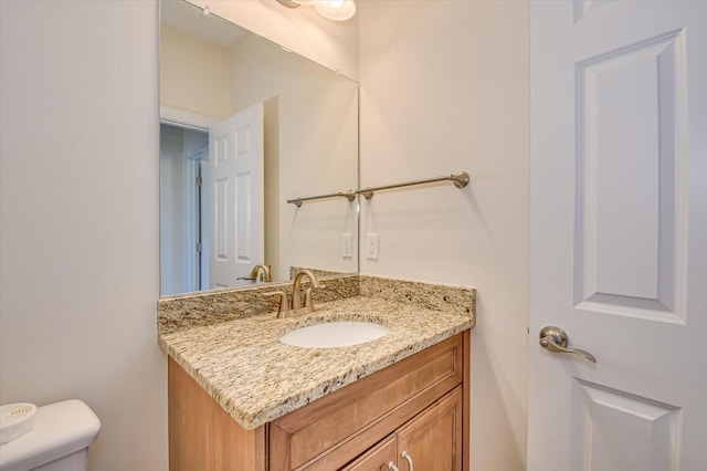 half bath with toilet and vanity