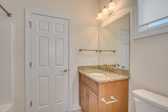 bathroom with toilet and vanity