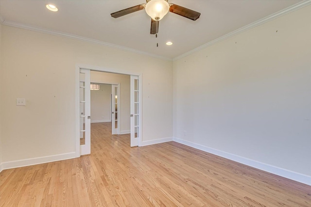 unfurnished room with ornamental molding, light wood-type flooring, french doors, and baseboards