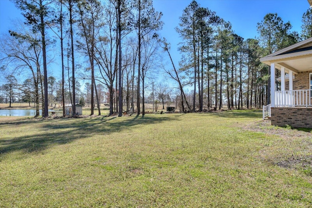 view of yard with a water view