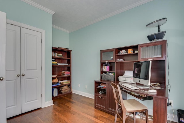 office featuring baseboards, ornamental molding, and wood finished floors