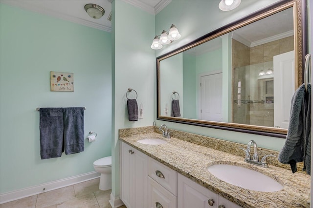 bathroom featuring crown molding, a stall shower, and a sink