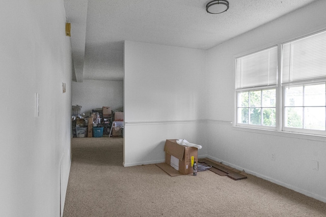 208 W W Hall St, Thomson, GA 30824 - carpeted empty room with a textured ceiling