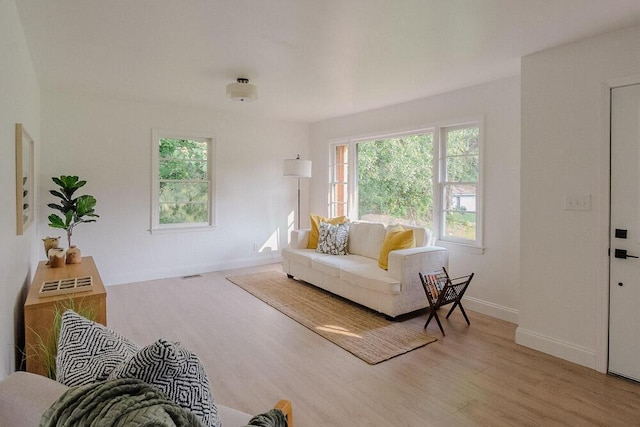 115 W St, Thomson, GA 30824 - living room with wood finished floors and baseboards