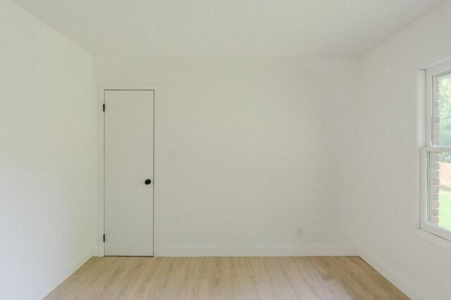 115 W St, Thomson, GA 30824 - unfurnished room featuring light wood finished floors and baseboards