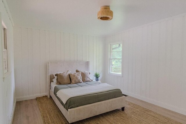 115 W St, Thomson, GA 30824 - bedroom featuring wood finished floors and baseboards