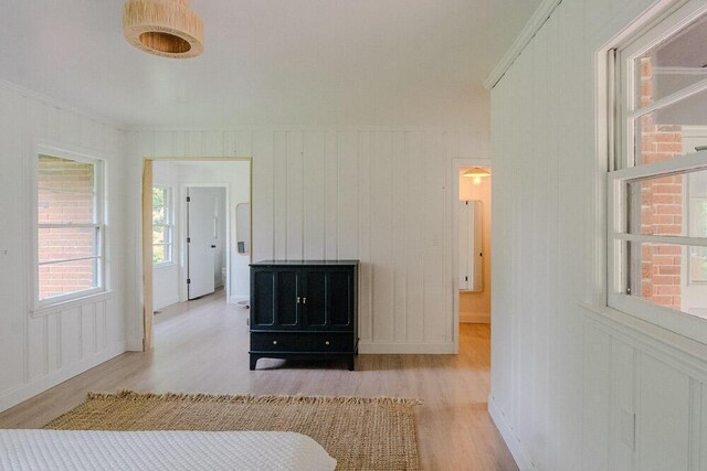 115 W St, Thomson, GA 30824 - bedroom featuring wood finished floors, crown molding, and a decorative wall