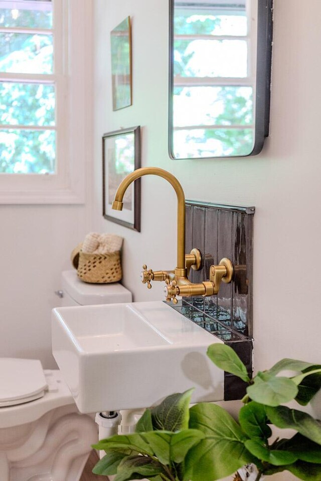 115 W St, Thomson, GA 30824 - bathroom with toilet and a sink