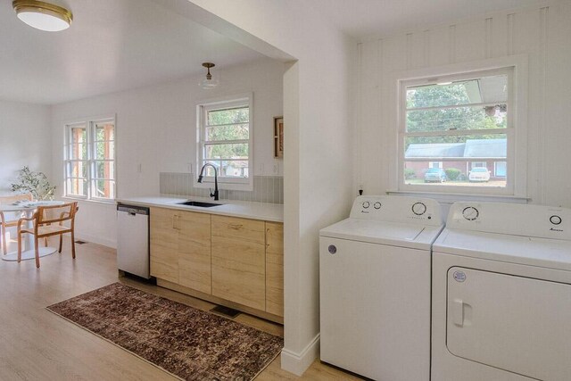 115 W St, Thomson, GA 30824 - laundry room featuring independent washer and dryer and light wood-type flooring