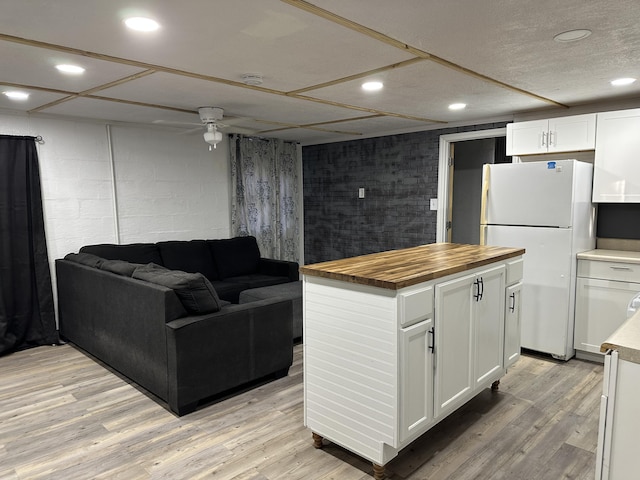 interior space with light hardwood / wood-style floors and ceiling fan