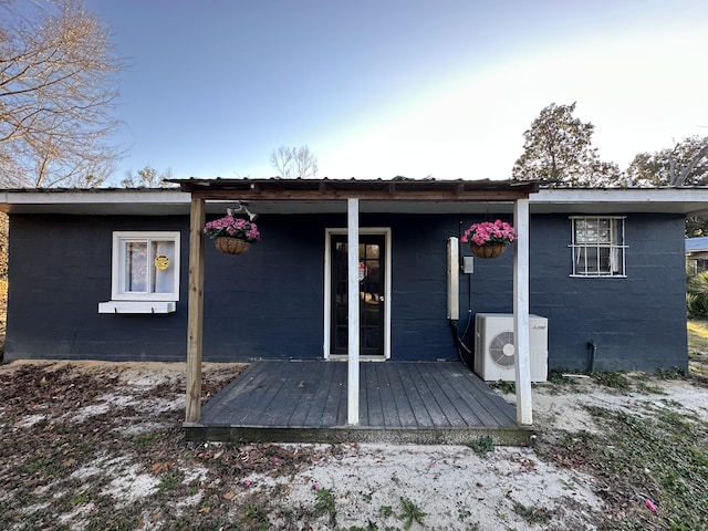 back of house featuring ac unit