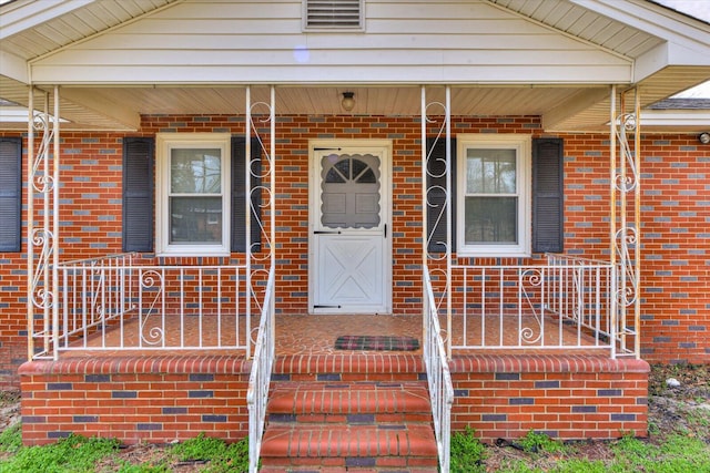 property entrance featuring covered porch