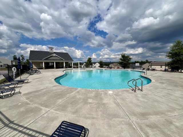 view of pool featuring a patio