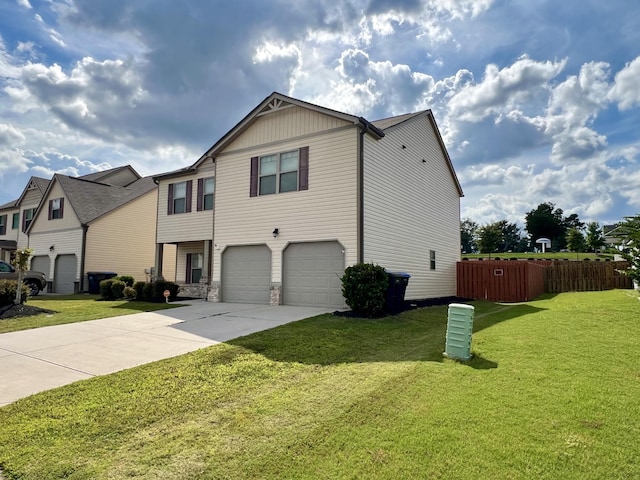 view of front of house with a garage and a front yard