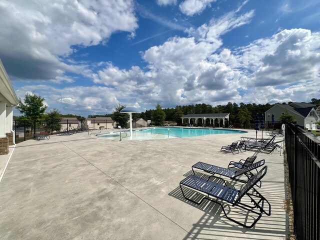 view of pool featuring a patio area