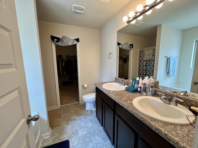 full bathroom with vanity, toilet, and plus walk in shower