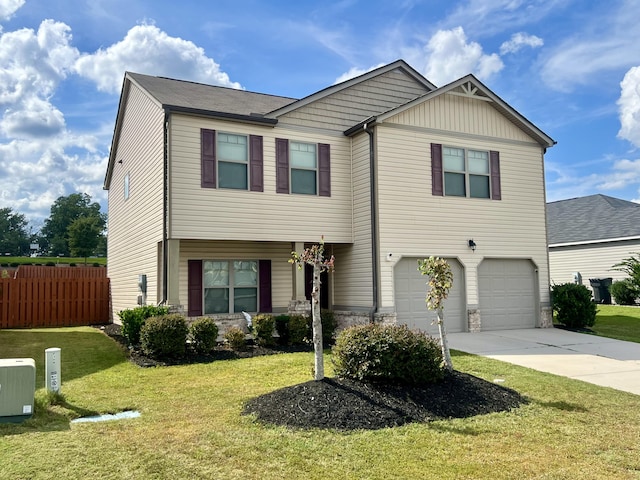 view of front of home with a garage and a front yard