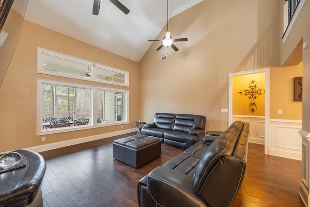 living room featuring visible vents, high vaulted ceiling, a ceiling fan, and dark wood-style flooring