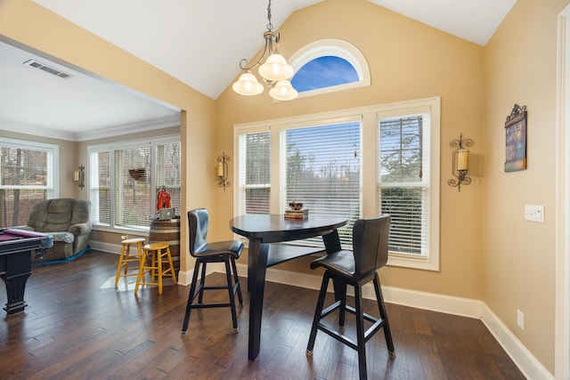 dining area featuring visible vents, baseboards, an inviting chandelier, lofted ceiling, and dark wood-style flooring