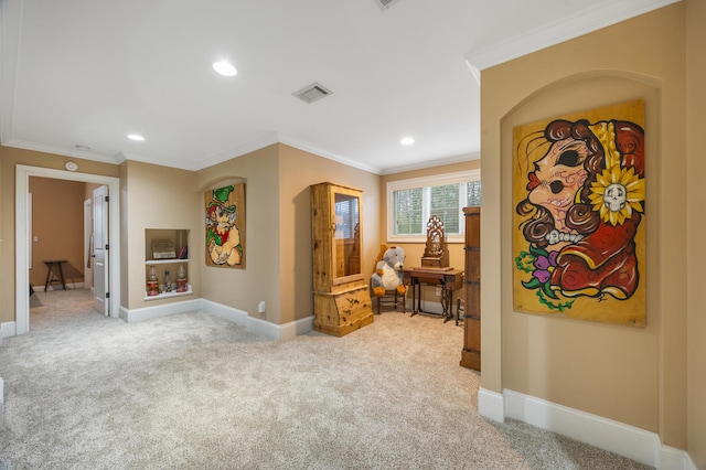 hall featuring visible vents, light carpet, baseboards, and crown molding