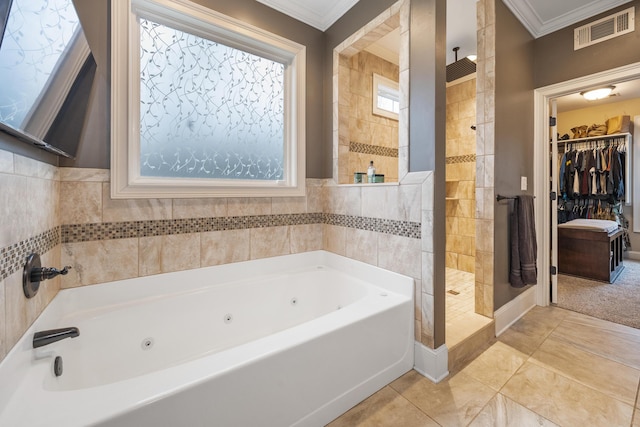 full bathroom featuring visible vents, ornamental molding, a jetted tub, a shower stall, and tile patterned flooring