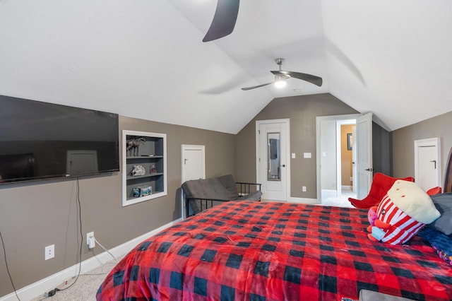 carpeted bedroom featuring baseboards, lofted ceiling, and a ceiling fan