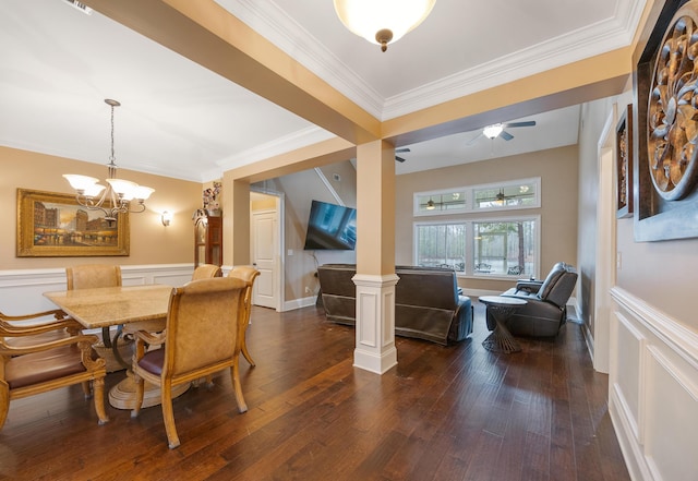 dining space with crown molding, dark wood-style floors, a wainscoted wall, and ornate columns