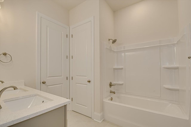 bathroom featuring tile patterned floors, shower / washtub combination, and vanity