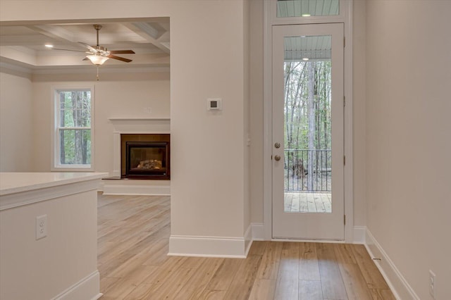 entryway with beam ceiling, ceiling fan, light hardwood / wood-style floors, and coffered ceiling